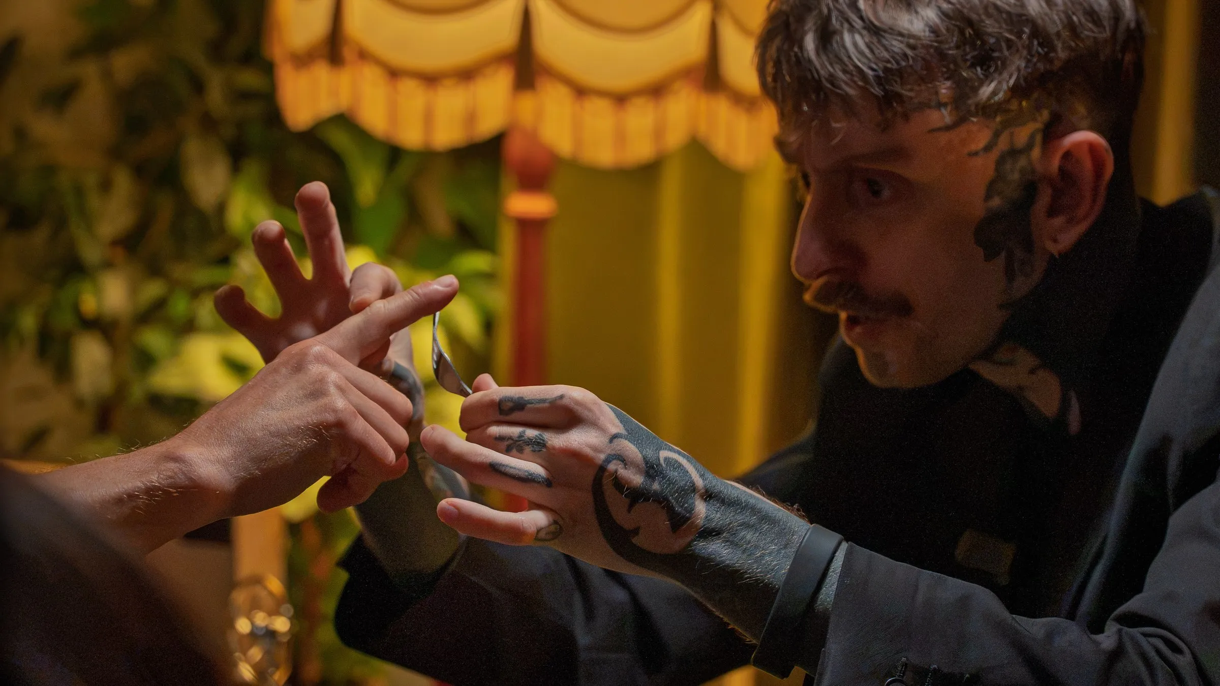 A close-up trick happening in a guest's hands, inches away