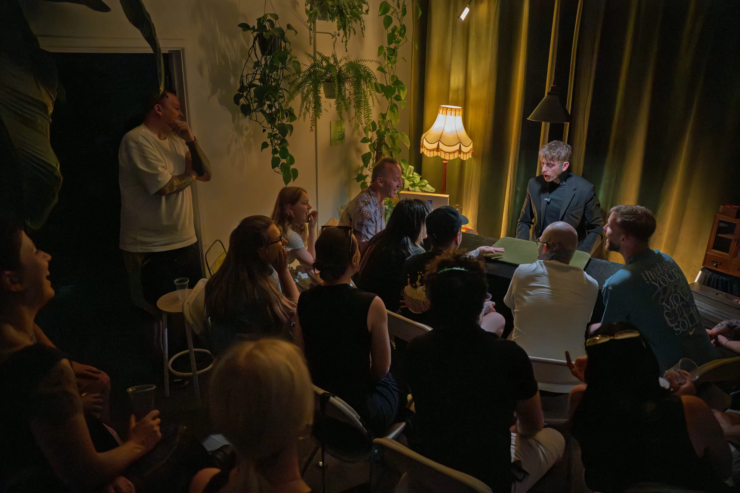 The magician performing by lamplight